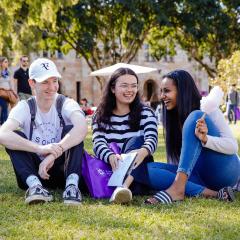 3 students sitting in the UQ Great Court